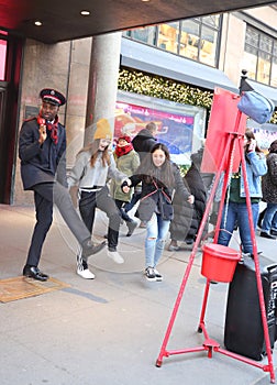 Salvation Army soldier performs for collections in midtown Manhattan.