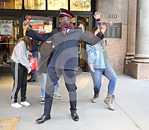 Salvation Army soldier performs for collections in midtown Manhattan.