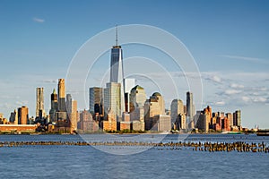 New York Financial District skyscrapers and Hudson River at sunset