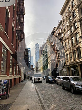 NEW YORK - JANUARY 6, 2022: Fedex van delivers packages in narrow streets of Soho