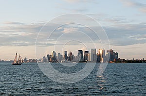 New York Manhattan skyline from bay just before sunset