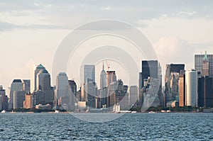 New York Manhattan skyline from bay just before sunset