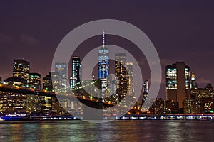 New York Manhattan skyline and Brooklyn Bridge by night