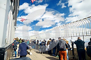 NEW YORK - MARCH 16, 2015: Tourists enjoying breathtaking views from the observation deck of Empire State Building.