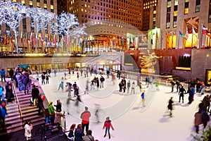 NEW YORK - MARCH 18, 2015: Tourists and newyorkers skate in the famous Rockefeller Center skatink rink, New York City.