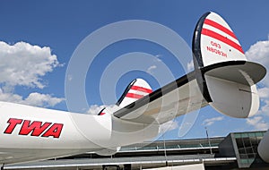 TWA Hotel`s 1958 Lockheed Constellation airplane in front of the landmark TWA Flight Center building designed by Eero Saarinen