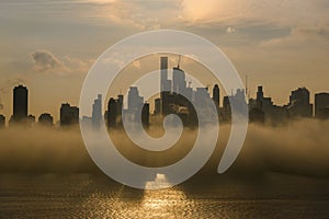 New York Midtown at sunrise covered with dence fog