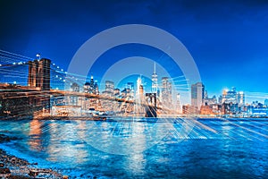 New York night view of the Lower Manhattan and the Brooklyn Bridge across the East River