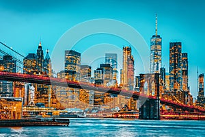 New York night view of the Lower Manhattan and the Brooklyn Bridge across the East River