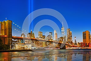 New York night view of the Lower Manhattan and the Brooklyn Bridge across the East River.