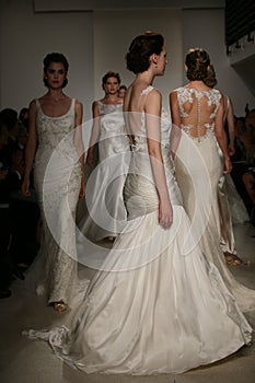 NEW YORK, NY - OCTOBER 10: Models walk the runway finale during the Anne Barge Fall 2015 Bridal Collection