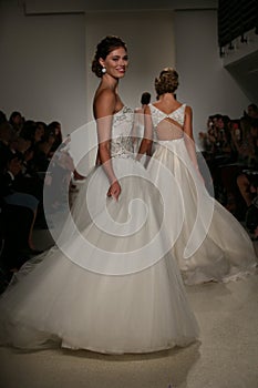 NEW YORK, NY - OCTOBER 10: Models walk the runway finale during the Anne Barge Fall 2015 Bridal Collection