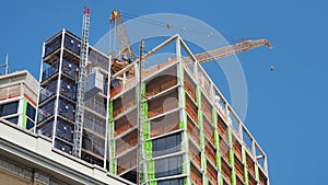 New York, NY, USA. New skyscrapers under construction. Construction site with cranes, elevators and scaffolding