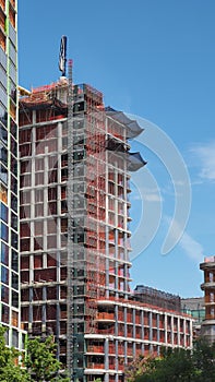 New York, NY, USA. New skyscrapers under construction. Construction site with cranes, elevators and scaffolding