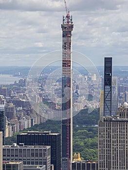 New York, NY, USA. New skyscrapers under construction. Construction site with cranes, elevators and scaffolding