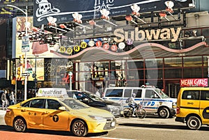 Rush hour and traffic jam with modern yellow taxi cab by 7th ave near Times Square in Manhattan