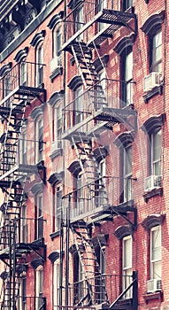 New York old building with fire escape, color toning applied, USA