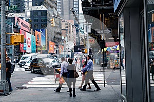 NEW YORK - SEPTEMBER 2, 2018: New York City street road in Manhattan at summer time, many cars, yellow taxis and busy people walk