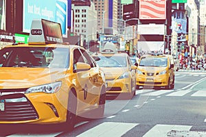 NEW YORK - SEPTEMBER 2, 2018: Yellow cab speeds through Times Sq