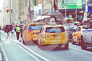 NEW YORK - SEPTEMBER 2, 2018: Yellow cab speeds through Times Sq