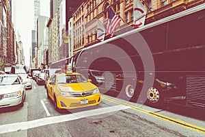 NEW YORK - SEPTEMBER 2, 2018: Yellow cab speeds through Times Sq