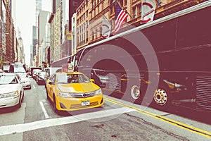 NEW YORK - SEPTEMBER 2, 2018: Yellow cab speeds through Times Sq