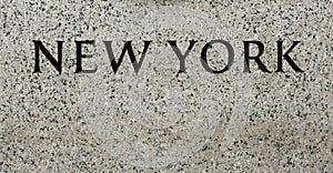 New York Sign on Stone