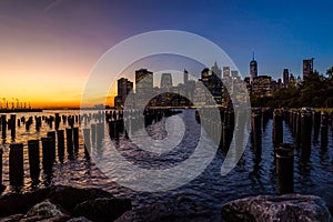 New York Skyline Cityscape Lower Manhatten World Trade Center Freedom Tower from Brooklyn Bridge Park Pier