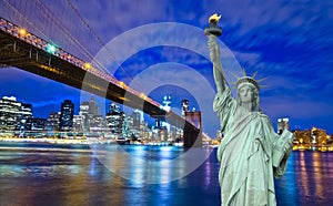 New York skyline and Liberty Statue at Night, NY, USA photo