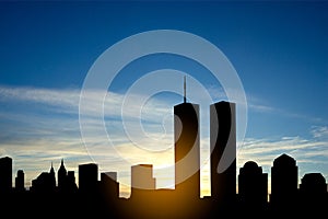 New York skyline silhouette with Twin Towers and against the sunset