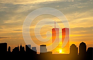 New York skyline silhouette with Twin Towers and against the sunset