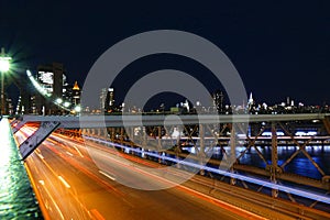 New York skyline, traffic at the Brooklyn Bridge at night, Manhattan buildings and skyscrapers