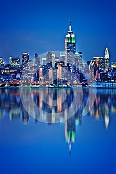 New York skyline with water reflections at night