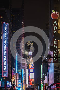 NEW YORK, USA - FEBRUARY 22, 2018: Time Square in New York City at night on a rainy day