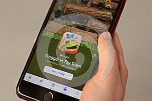 New York, USA - 1 May 2020: Frogger in Toy Town app logo close-up on phone screen, Illustrative Editorial