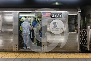 Passengers travelling on a subway train in New York City