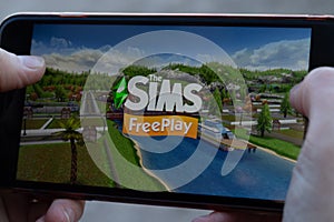 New York, USA - 1 May 2020: Sims FreePlay app logo close-up on phone screen, Illustrative Editorial