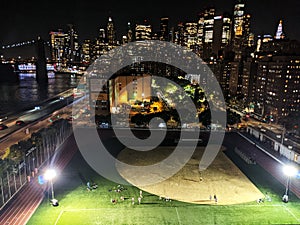 Baseball field with view of downtown Manhattan in NYC at night