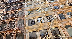 New York USA, old colorful classic buildings, facade, architecture, balcony and windows in Soho, Downtown Manhattan