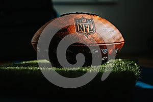 NFL Trademark: Leather Ball and Iconic Logo. Official National Football league ball places i