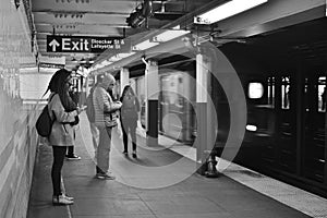 New Yorkers on Subway Platform Commuters Traveling MTA Train Arriving