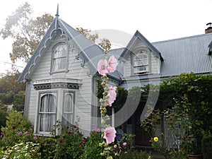 New Zealand: Akaroa historic 19th century grey house photo