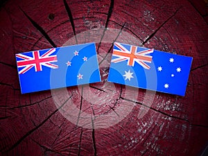 New Zealand flag with Australian flag on a tree stump