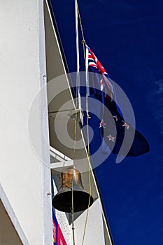 The New Zealand flag flies at half mast