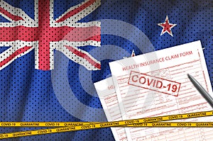 New Zealand flag and Health insurance claim form with covid-19 stamp. Coronavirus or 2019-nCov virus concept