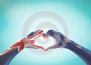 New Zealand flag pattern on people hands in heart shape for NZ national public holiday celebration