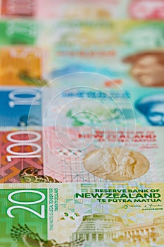 New Zealand money, Banknotes of different values spread out on a table, vertical photo