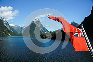 New Zealand Red Ensign maritime flag on a boat on Milford Sound