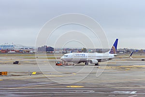 At Newark International Airport EWR passenger airplane United Airlines prepares to depart with on runway