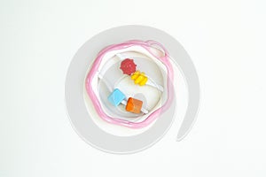 Newbor toy. A colorful baby rattle on a white horizontal background photo